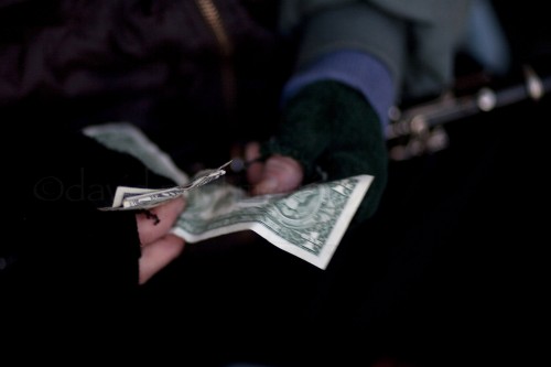 Craig the "Mystro of North Beach" Craig aka the "Mystro of North Beach" counts his money as he plays his clarinet along Columbus street