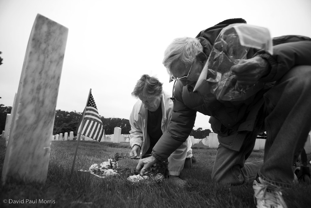 20090523DPM011_memorial.jpg 86 year old Charles W. Long and his wife Pauline, 82 lay flowers at the grave of her father, Pvt Harry C. Wright from California.