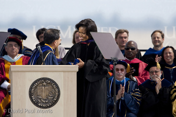 First Lady Michelle Obama receives the Chancellor's Medal from Sung-Mo Kang after she made the commencement speech at the University of California, Merced