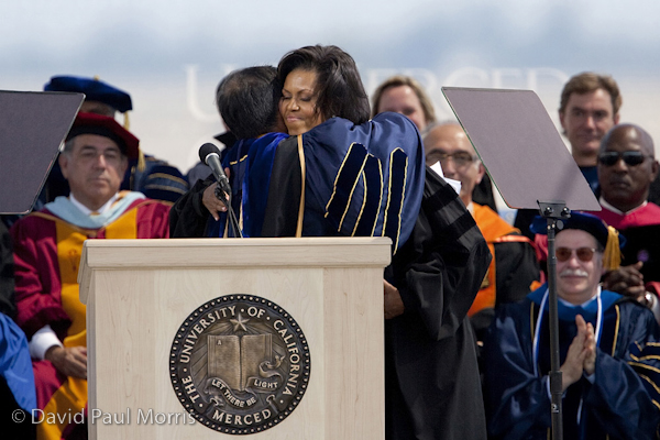 85974344DPM170 First Lady Michelle Obama hugs Sung-Mo Kang after she received the Chancellor's Medal after she made the commencement speech at the University of California, Merced