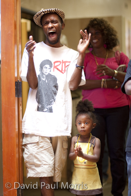 _P4Z9367.CR2 Ambessa Cantave, co-founder of Grind For The Green enjoys the performance with this daugter Aissade, 3 at the Art In Action Youth Leadership Program facility