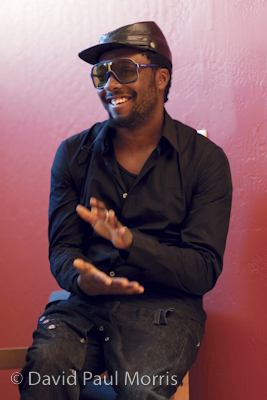 Black Eyed Peas front man will.i.am shows his appreciation during a performance at the Art In Action facility in Oakland, California.