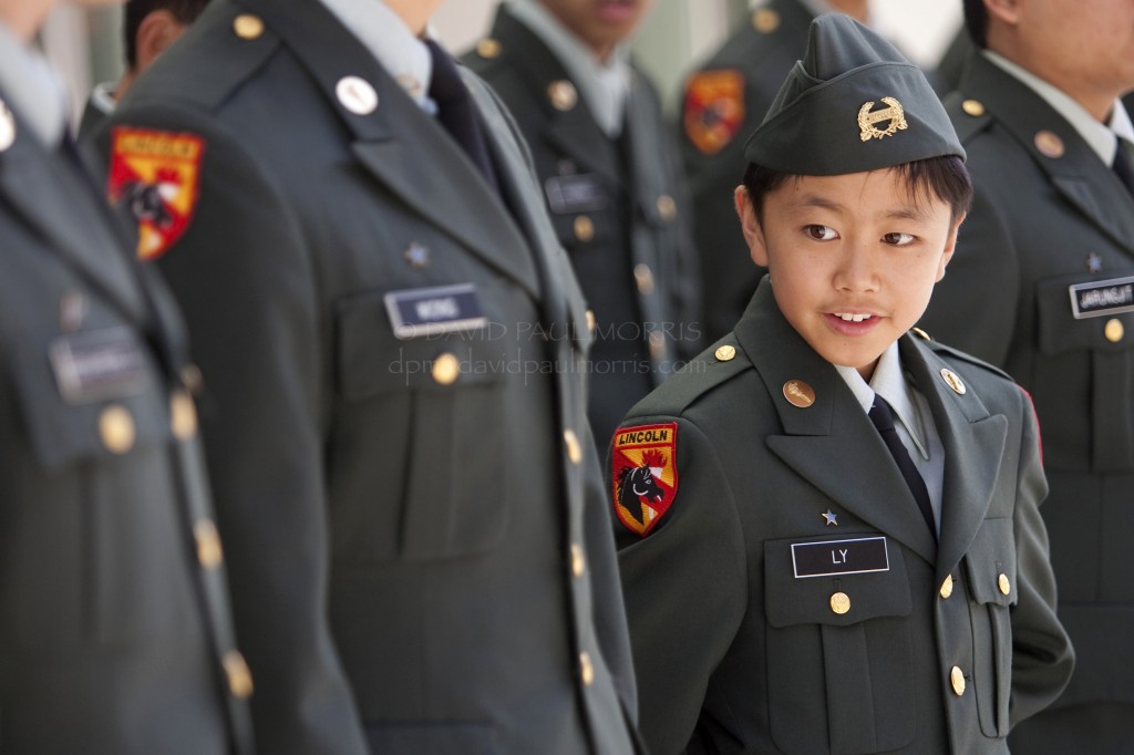 veterans Grant Ly, 14 and a member of the Abraham Lincoln High School JR ROTC program waits to start the Veterans Day Parade.