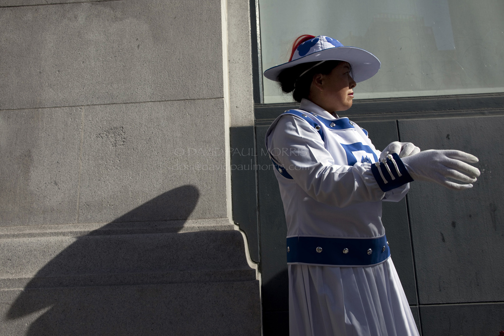 veterans Mimi Zhang prepares her costume before the start of the Veterans Day Parade.