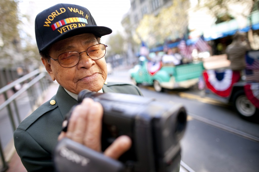 veterans Alfredo C. Carino, 85 and a veteran of World War II takes video during the Veterans Day Parade.