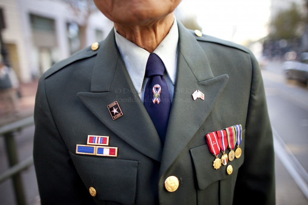 veterans Alfredo C. Carino, 85 and a veteran of World War II watches the Veterans Day Parade.
