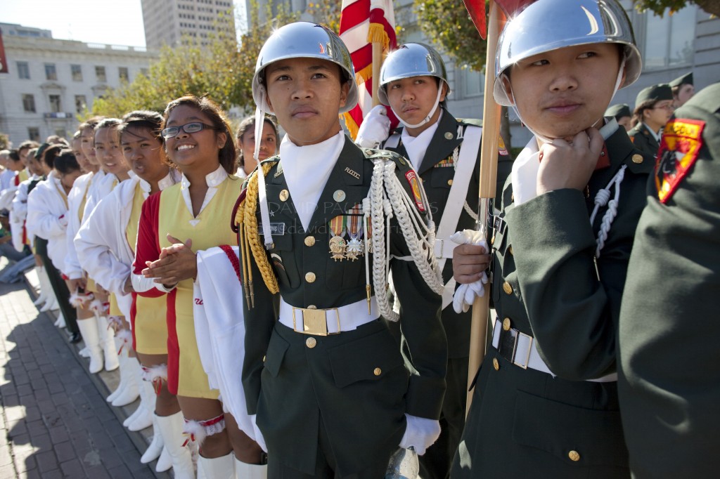 veterans (R-L) Alexander Ng, Steven Zheng, Anthony Truong, Deeana Datangel and Christine Ramierz all from Abraham Lincoln High School watch other ROTC members perform during the Veterans Day Parade.
