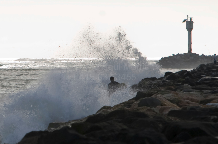 tsunami28 A man gets sprayed as the waves crash into the jetty at Pillar Point during a tsunami warning that was a result of an 8.8 earthquake in Chile February 27, 2010 in Half Moon Bay, Calif.